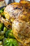 instant pot whole roast chicken on platter with broccoli
