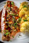 baked Maple Balsamic Trout on plate with roasted cauliflower
