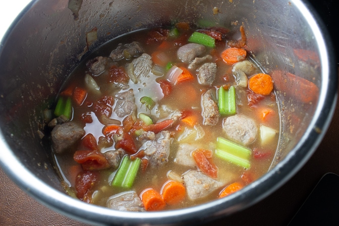 Veal Stew in instant pot with liquids added ready to turn pressure on