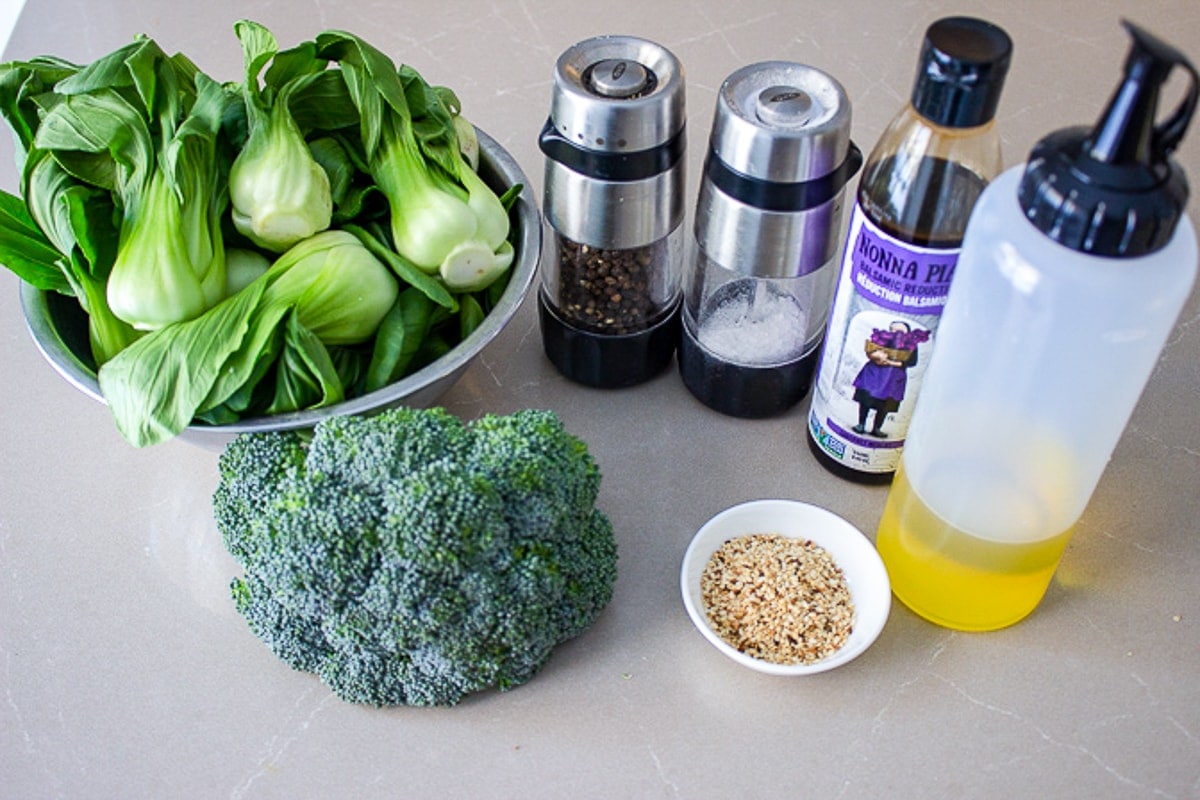 bok choy, broccoli, salt, pepper, balsamic reduction, oil, sesame seeds