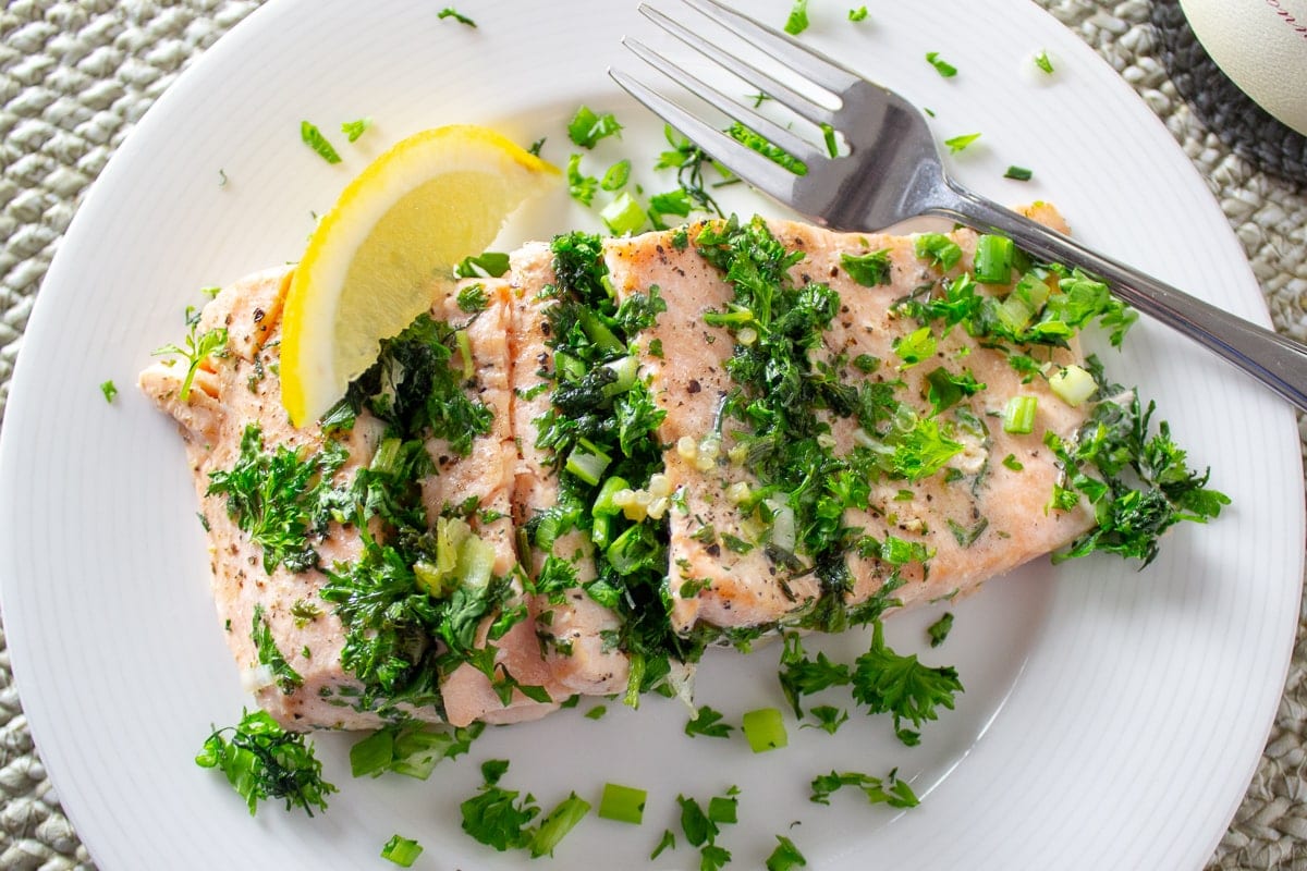 herb roasted salmon on plate with lemon 1