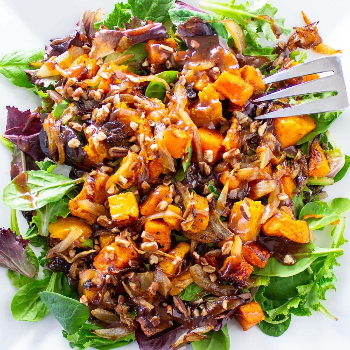 butternut squash salad with cinnamon dressing on plate