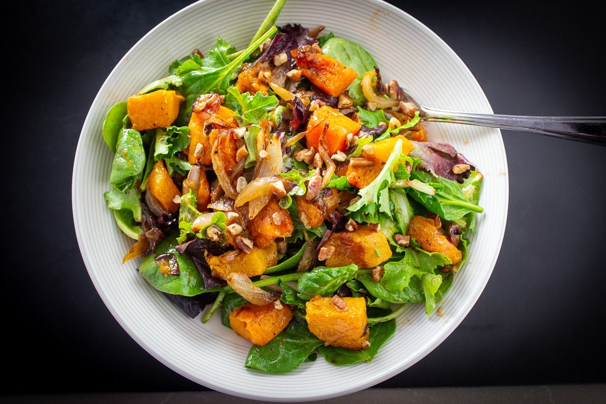 butternut squash salad with cinnamon dressing in bowl