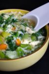 bowl of easy Egg Drop Soup with chinese soup spoon p2