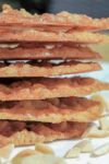 crispy, buttery Lace Cookies stacked on plate