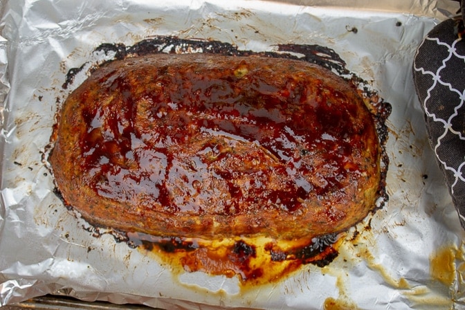 baked chicken meatloaf with glaze topping on pan