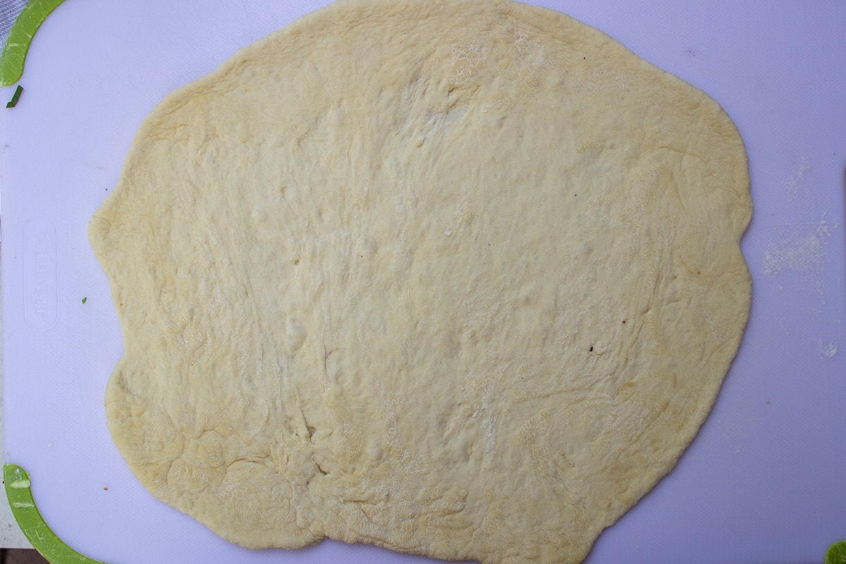 pizza dough stretched into a circle