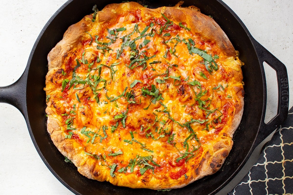 thin crusted pizza in skillet