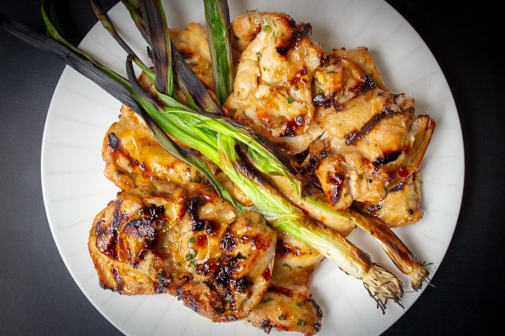 Grilled Vietnamese Chicken with grilled green onion on plate ff
