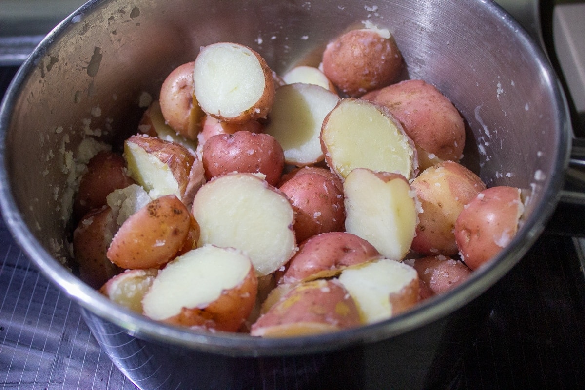 boiled baby potatoes in pot drained