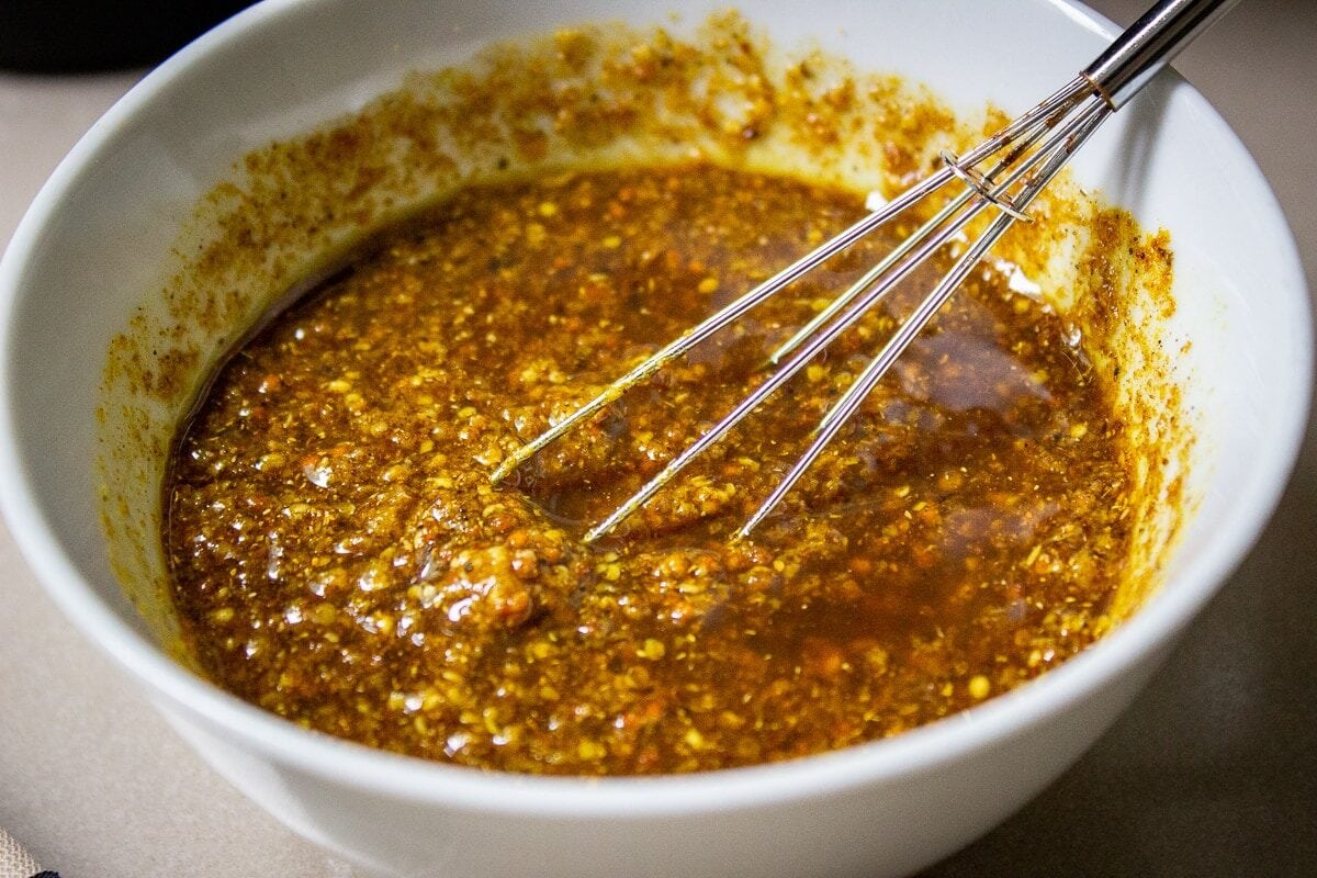 mix of indian spices with oil in bowl