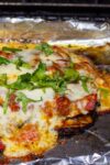 Eggplant Parmesan in baking pan after grilling on bbq
