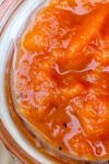 savory peach sauce in a jar top down view p