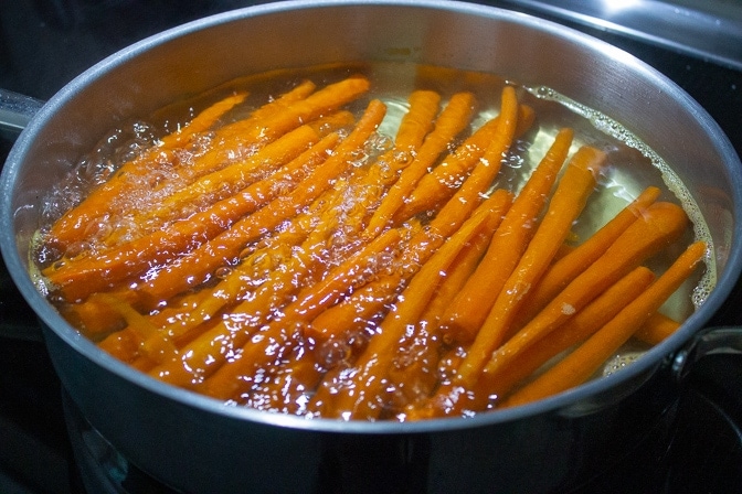 carrots parboiling in pan on stove