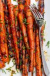 Grilled Carrots with Balsamic Glaze on a plate with a serving fork p1