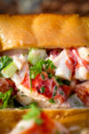 lobster roll on plate close up p