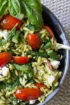 Pesto Orzo and Vegetables in bowl on placemat