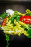 forkful of pesto orzo and vegetables p2