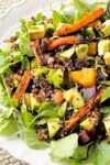 red quinoa salad with roasted carrots on a serving platter p