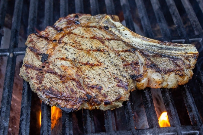 steak cooking on hot grill