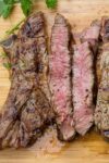 sliced grilled rib steak on cutting board p2