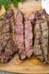 sliced grilled rib steak on cutting board p1