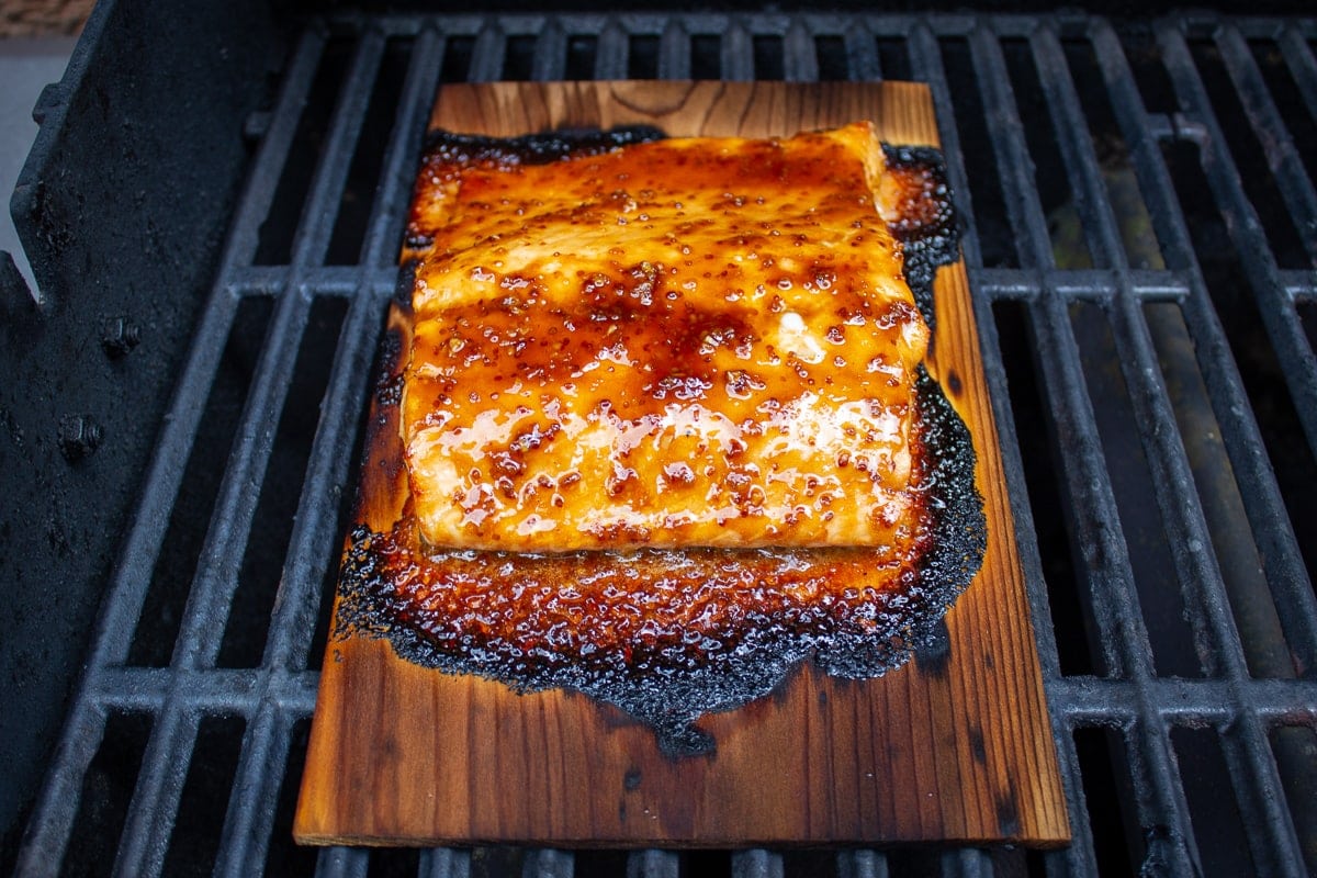 planked salmon on grill with glaze