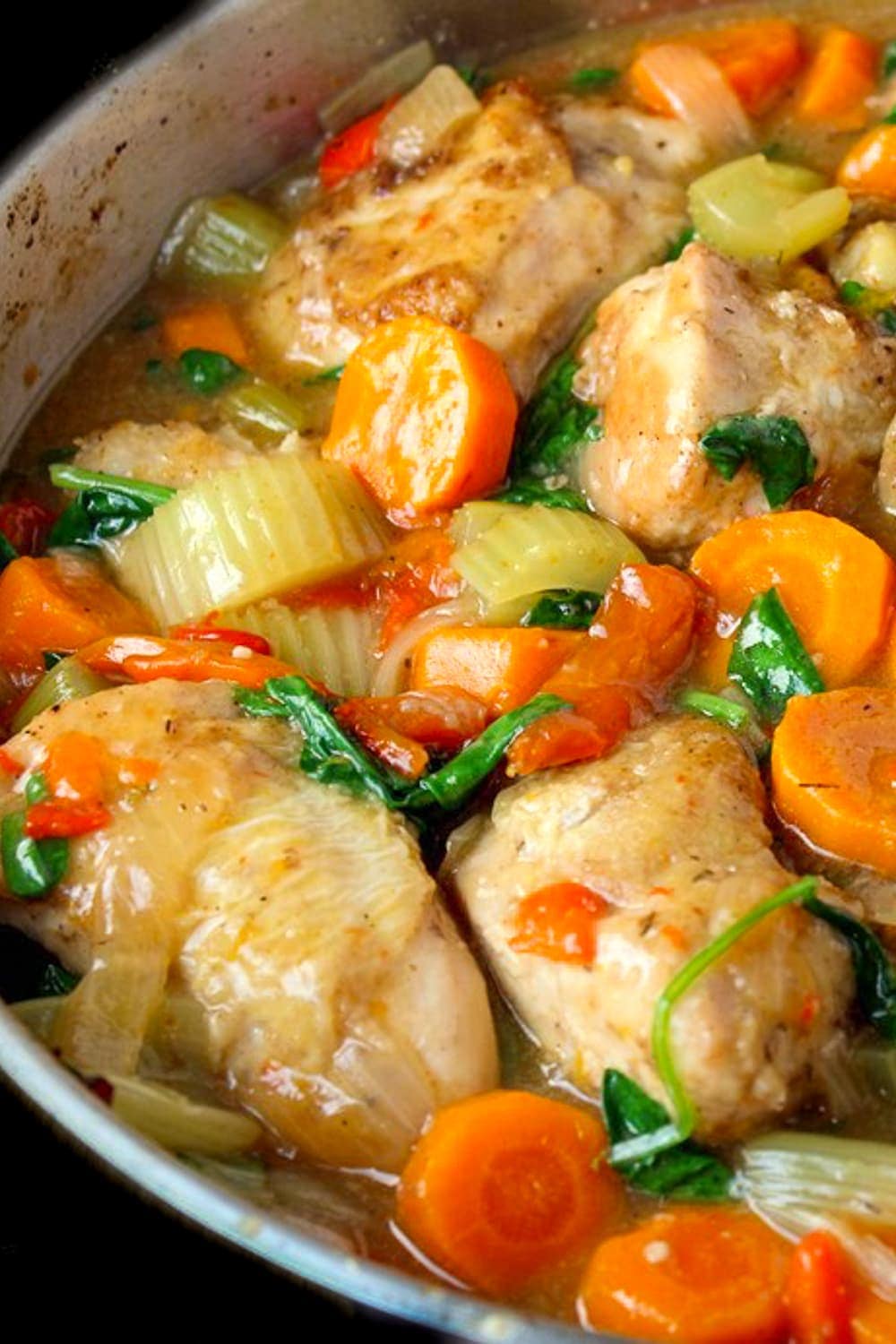 chicken and vegetables in sauce in skillet p