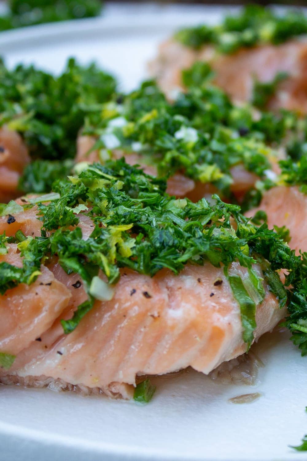 Slow Roasted Salmon With Gremolata close up cut up on plate