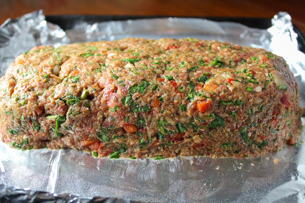 raw meat loaf on pan