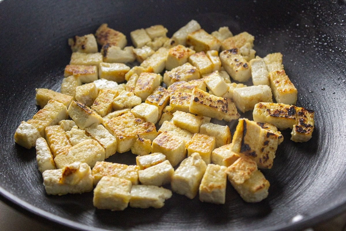 tofu frying in pan