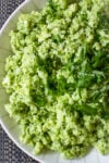 Cauliflower rice with pesto in a bowl.