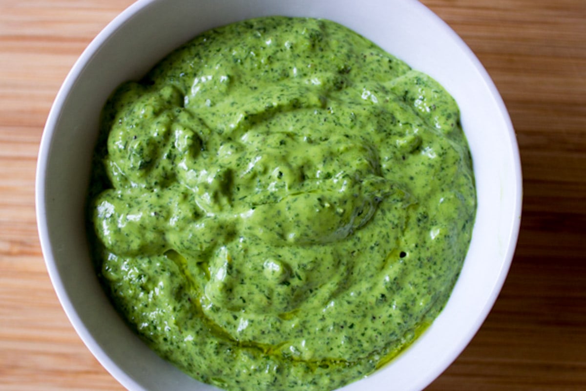Spinach basil pesto in a bowl.