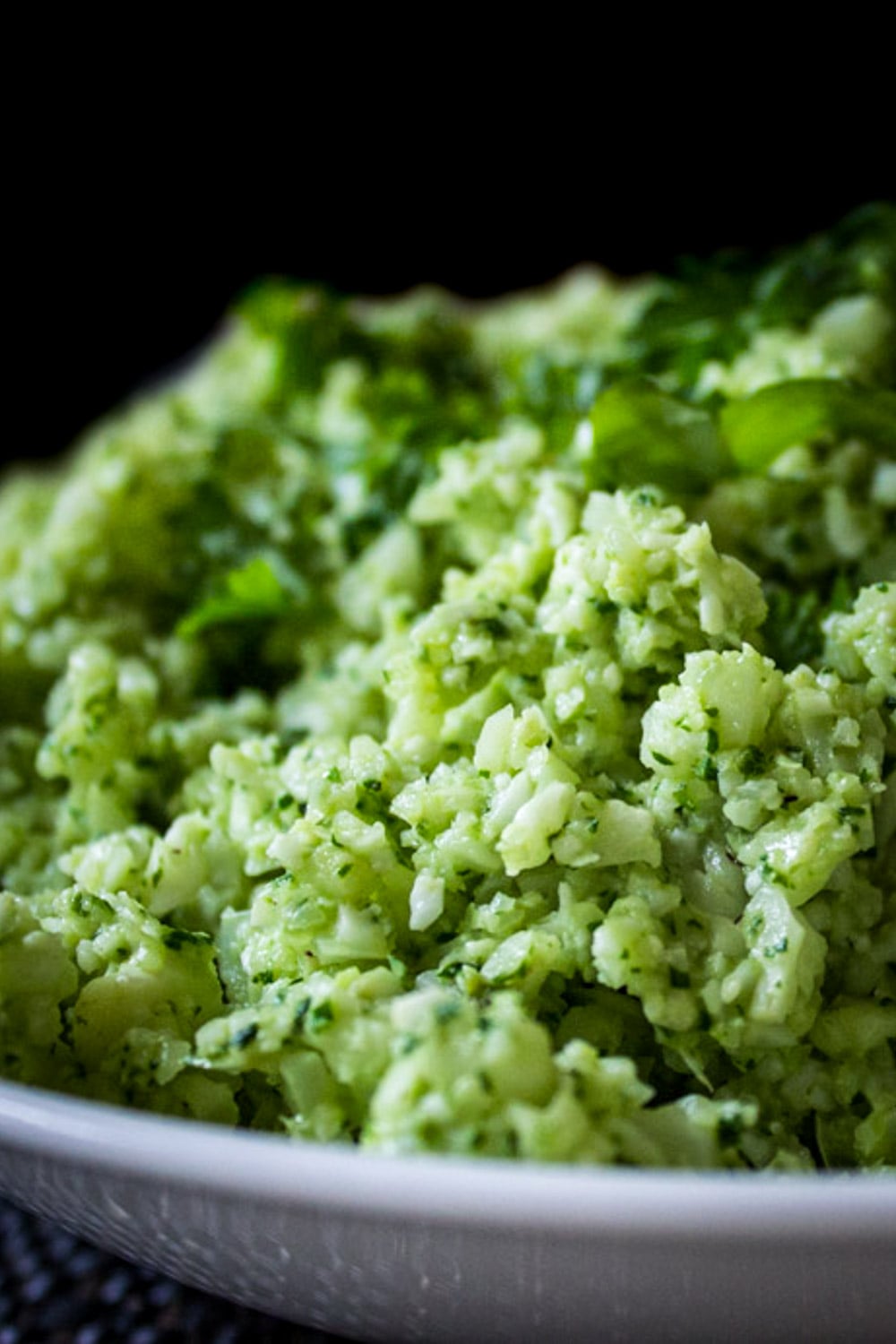 Cauliflower rice with pesto in a bowl.