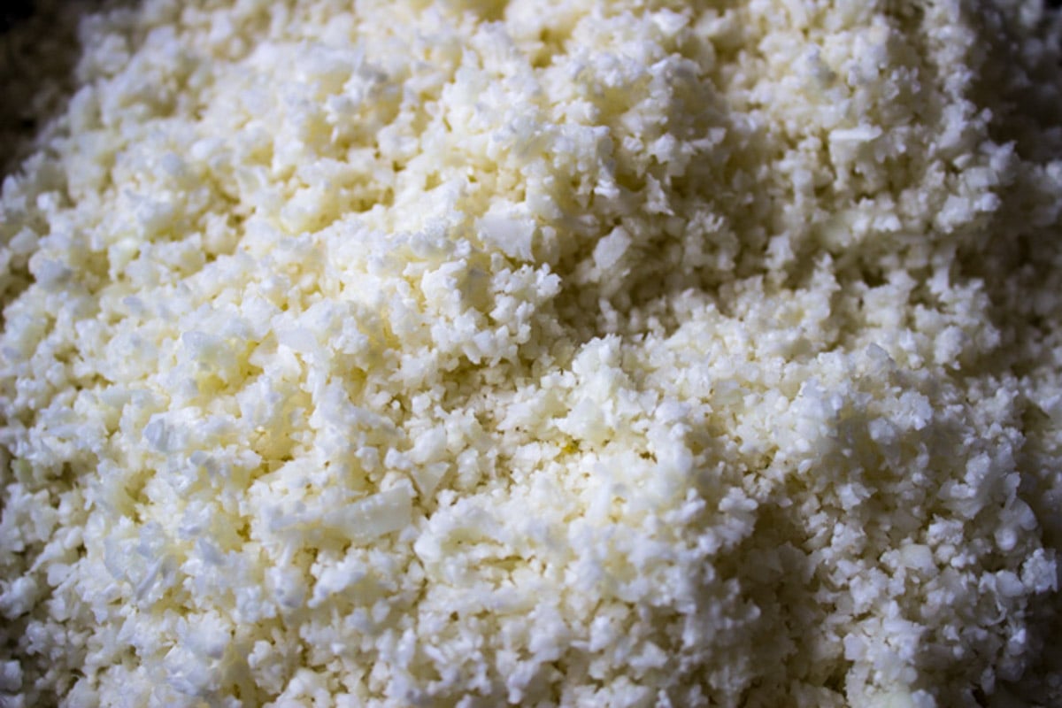 Cooked cauliflower rice in skillet.