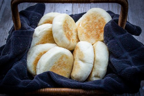 10 English muffins in a basket