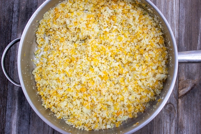 rice sized butternut squash and Cauliflower cooking in a pan