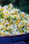 Lemon herb Cauliflower rice in a bowl side view p4
