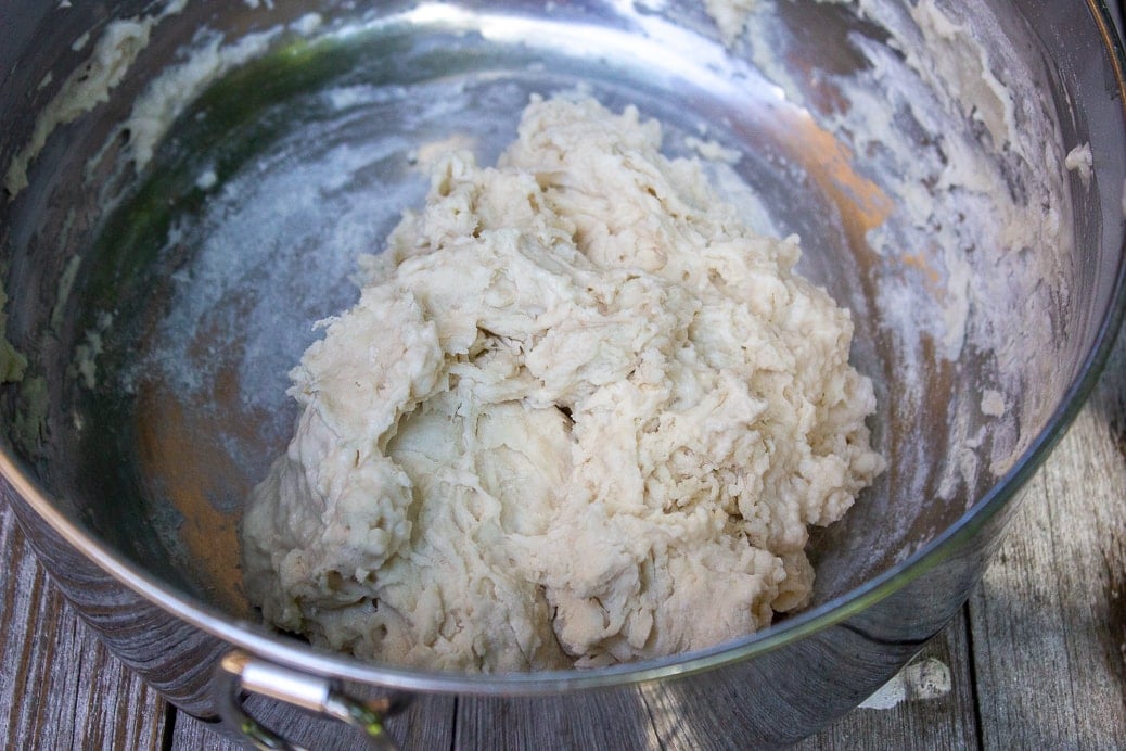 dough mixture not yet rolled in bowl