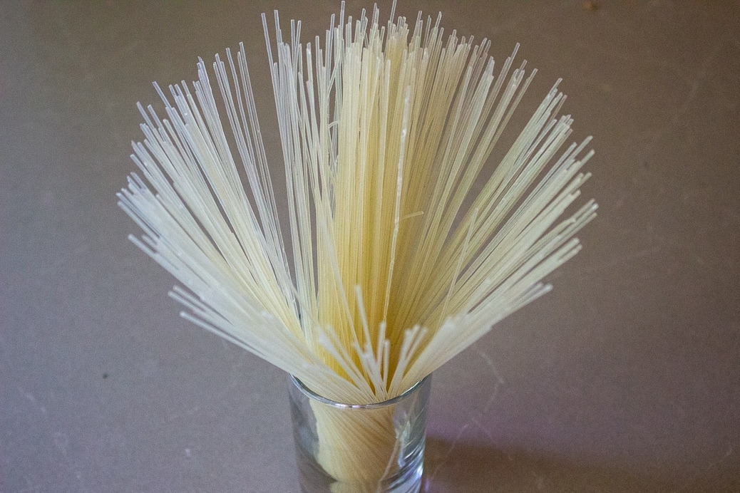 dry vermicelli noodles in glass on table