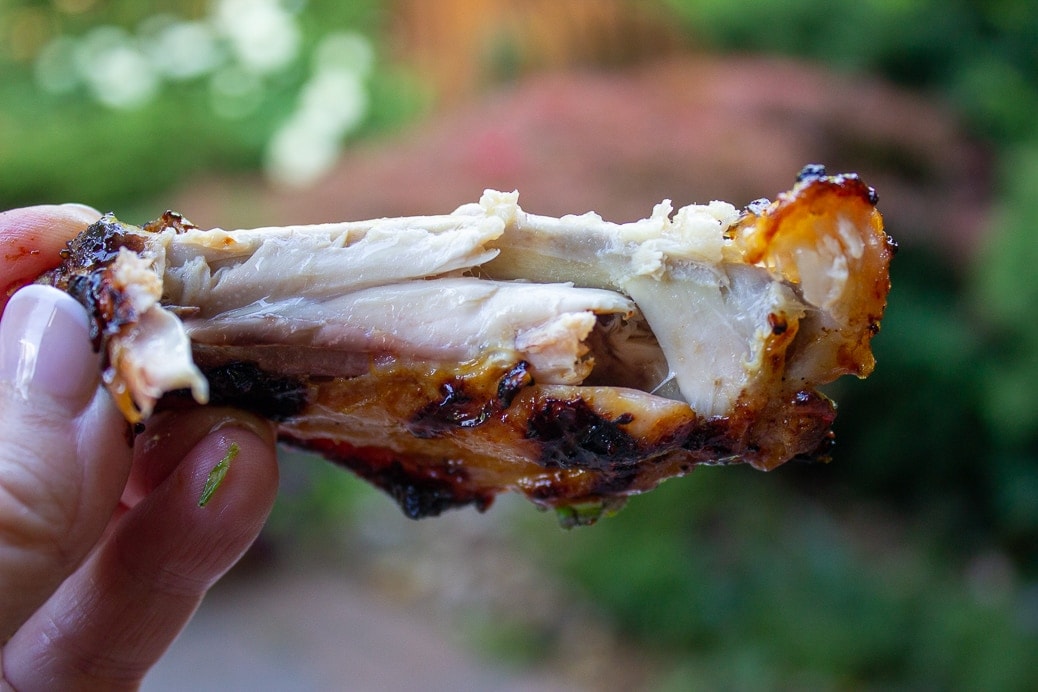 inside of a chicken wing showing tender meat