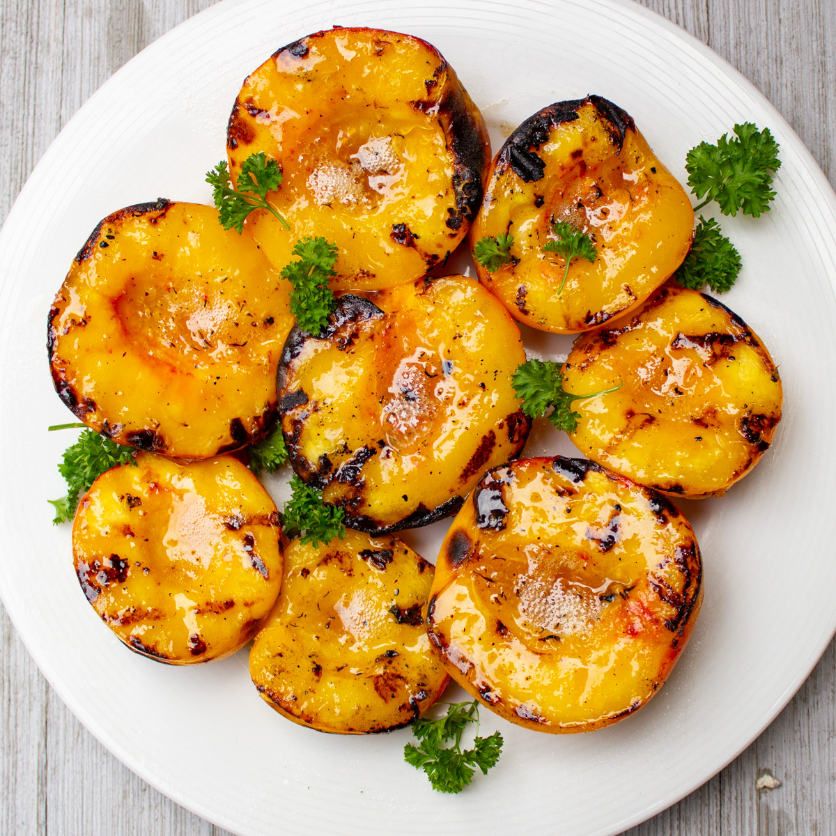 grilled peach halves on plate