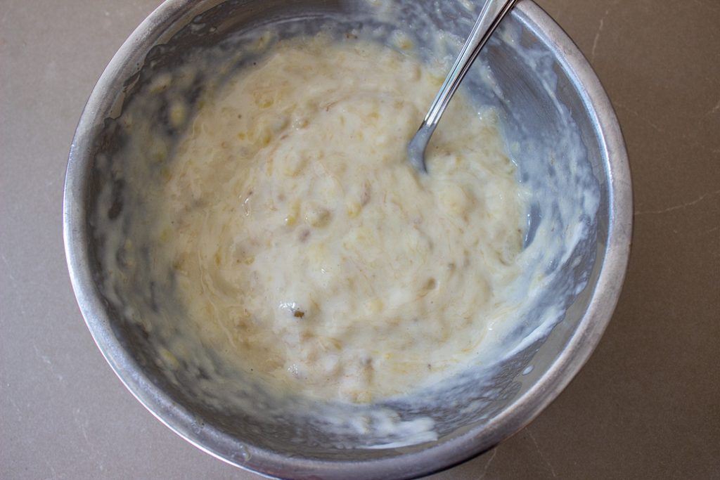 yogurt and mashed bananas in bowl