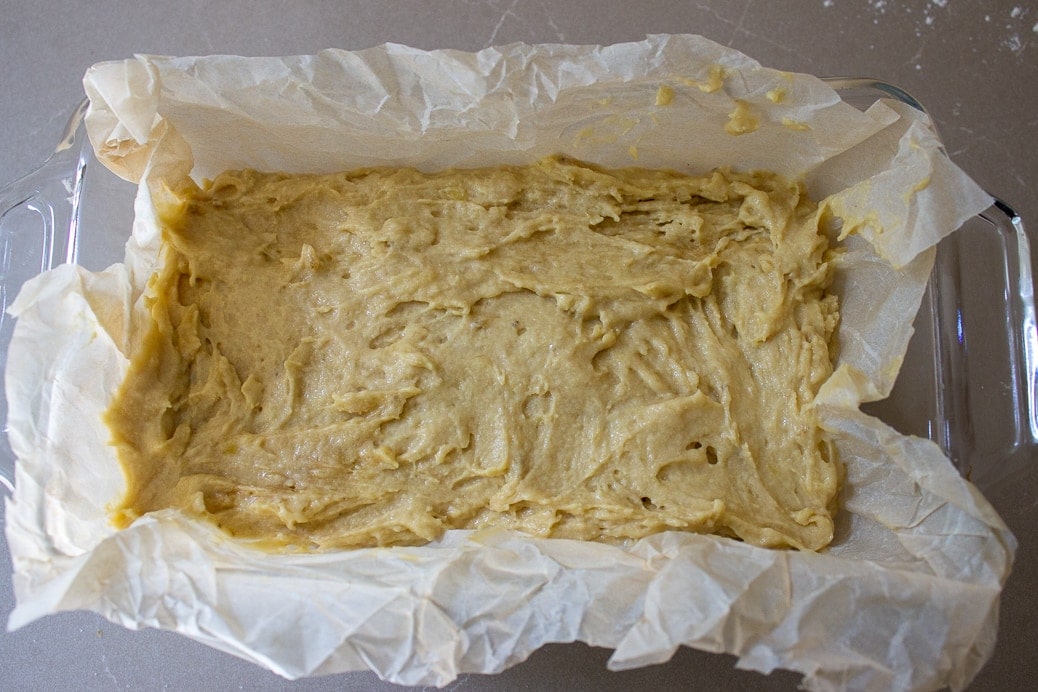 batter in loaf pan lined with parchment