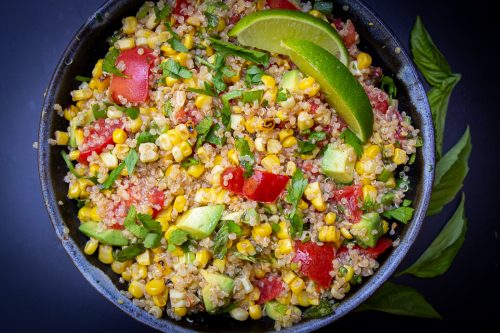 Corn and tomato salad with quinoa in bowl f
