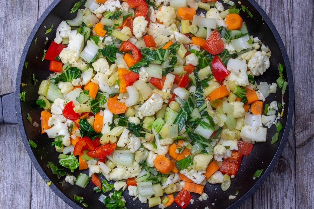 veggies frying in pan