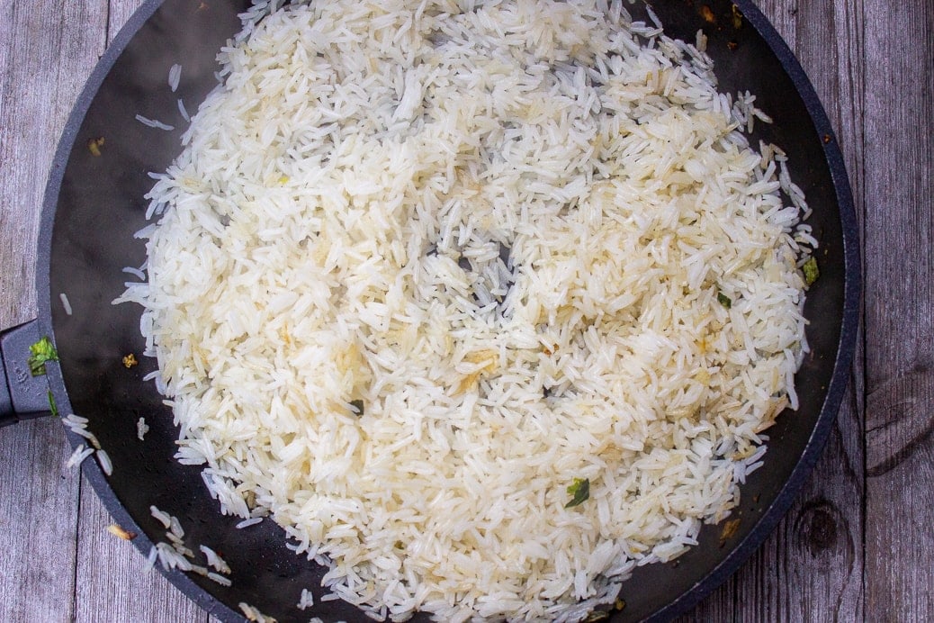 rice frying in pan