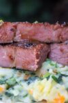 sous vide Kalbi short ribs cut oven over mashed veggies on plate p