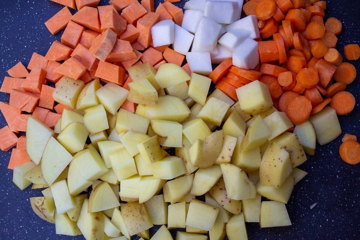 cubed root vegetables on cutting board