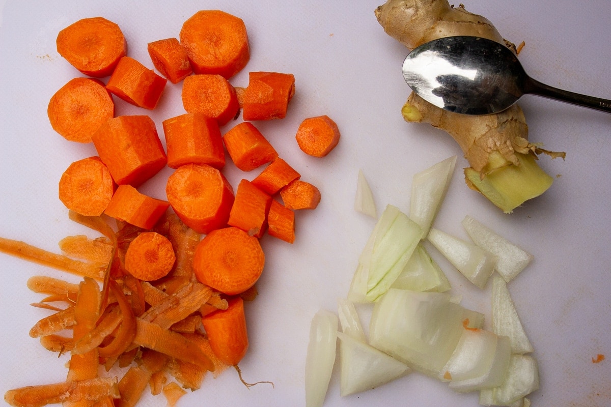 chopped carrots and onion and skin of ginger peeled with spoon